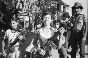 Two FMLN guerrillas holding automatic weapons