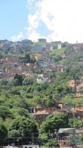 Photo of steep hillside with homes. Providing water to Caracas's hillside barrios such as Antímano is no easy feat.