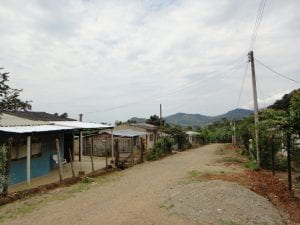 A street in Mocoa, Columbia, with homes to one side.
