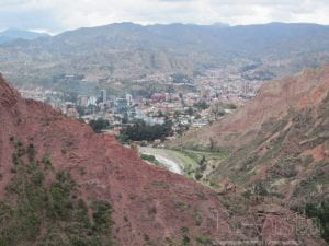Aerial view of the city of La Paz, Bolivia, situated in a valley between hills.
