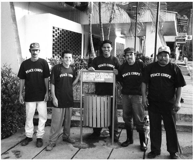 Five garbage men from la Trinidad wear Peace Corps T-shirts as thanks for their participation in a sanitation campaign.