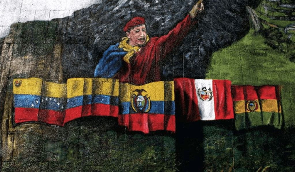 Mural depicts Hugo Chávez as the leader of Latin American unity., with flags from Columbia, Venezuela, Ecuador, Peru, and Bolivia below him.